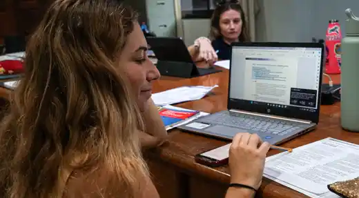Divemaster students studying dive theory during professional training on Koh Tao