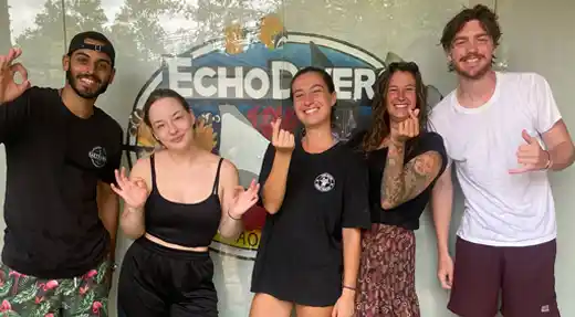 Group of smiling SSI Advanced Open Water students posing at Echo Divers Koh Tao.