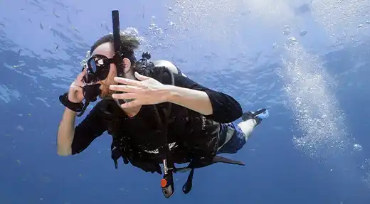 Echo Divers Koh Tao SSI Perfect Buoyancy diver practising trim and buoyancy control in mid-water, Koh Tao, Thailand